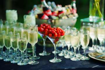 Strawberries in a glass as an appetizer for champagne at a banquet. 