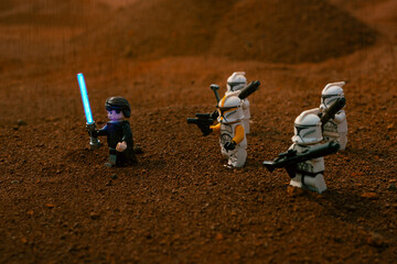 Obraz premium Depok, Indonesia - May 17, 2024: Lego toys photography, Anakin skywalker and phase 1 clone troopers on battle of geonosis recreation, during sandstorm
