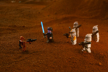 Naklejka premium Depok, Indonesia - May 17, 2024: Lego toys photography, Anakin skywalker and phase 1 clone troopers on battle of geonosis recreation, during sandstorm