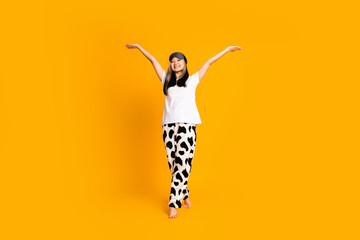 Full length photo of positive cheerful adorable cute woman enjoy vacation in pajama isolated on...
