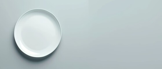 Simple and clean shot of a plain white plate on a smooth table, minimalist design perfect for adding text