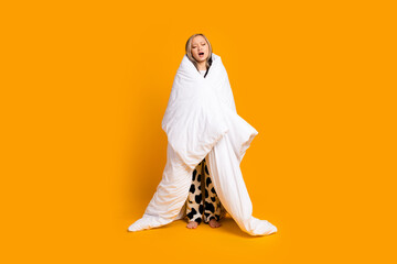 Full length photo of adorable lovely cute woman wrapped warm blanket isolated on yellow color background