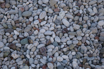 A variety of pebblel mixes on the floor, backgound.