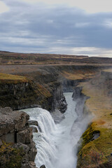 Panoramic view on Gullfoss waterfall on the Hvíta river, a popular tourist attraction and part of the Golden Circle Tourist Route in Southwest Iceland. Golden Waterfall.