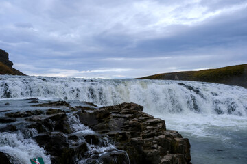 Panoramic view on Gullfoss waterfall on the Hvíta river, a popular tourist attraction and part of the Golden Circle Tourist Route in Southwest Iceland. Golden Waterfall.