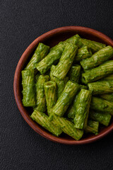 Delicious pasta with spinach sauce, olive oil and parmesan cheese