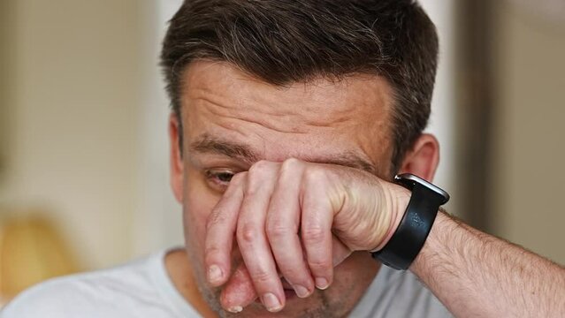 close-up. A middle-aged man is crying. men's pain and resentment. psychological support in crisis situations.