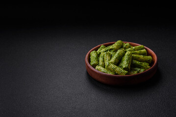 Delicious pasta with spinach sauce, olive oil and parmesan cheese