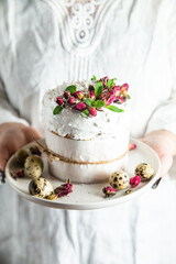 Easter cake with Swiss meringue and  flowers. Easter eggs
