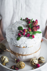 Easter cake with Swiss meringue and  flowers. Easter eggs