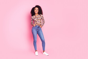 Full length photo of girlish pretty lady dressed print shirt smiling empty space isolated pink color background