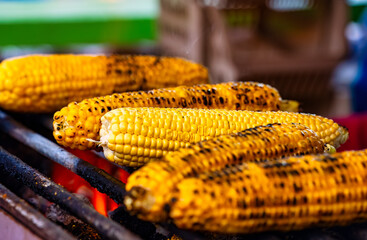 Corn is fried on a grill. Street food.