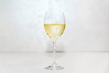 One full wine glasses on the table in the interior. Festive background for wedding, birthday or Christmas.