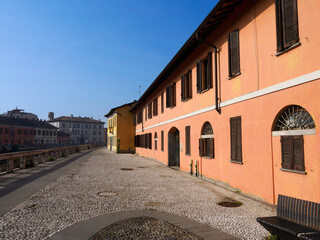 Fototapeta premium Gaggiano, Milan Italy: exterior of historic houses along the Naviglio Grande