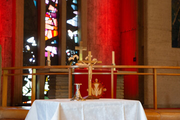 altar in church with cross and candle