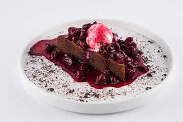 chocolate dessert with ice cream and berry syrup