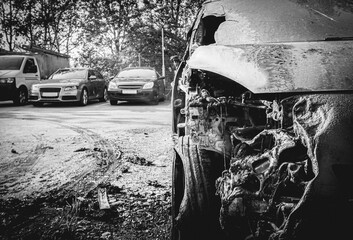 close-up of a burned-out car