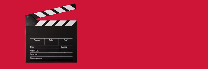 Obraz premium Cinema clapperboard on a red background, copy space, film, producer, Hollywood.
