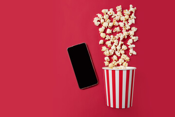 Cinema mobile app, movie tickets online, Popcorn bucket with soda cup and clapper board with phone,...