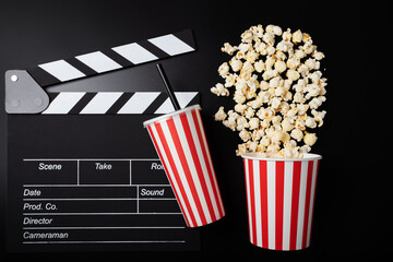 Cinema clapper board and Popcorn bucket with soda cup, Hollywood movie night, cinematography...