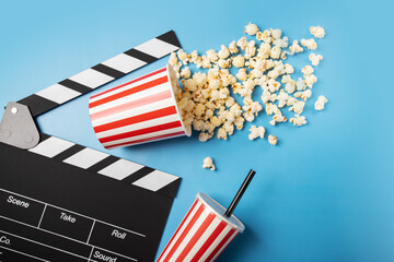 Popcorn sweet bucket with soda cup and Cinema clapper board, family entertainment, movie night,...