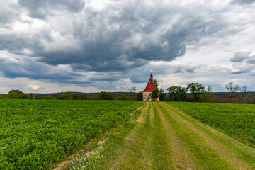 Old church in the summer field. Dobronice u Bechyne, Czech republic.