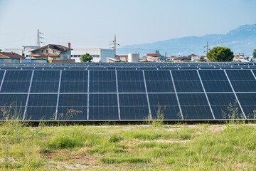 Solar photovoltaic panels in solar farm used to produce mill in a flour mill in Tirana, Albania....