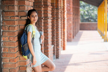 College Girl Standing on a Campus Outdoor
