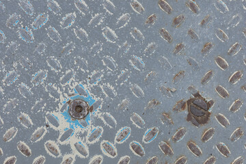 rusty embossed sheet metal surface, close-up