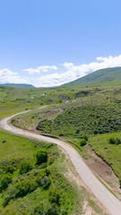 The highway and green grass. Тaken with a drone. Landscape (drone image)