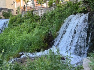 Waterfall in the middle of the town of Trillo in Guadalajara, Castilla la Mancha, Spain.