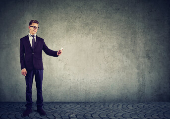 Fototapeta premium Young businessman using a mobile phone 
