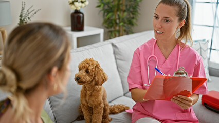 Young caucasian woman with dog veterinarian smiling confident taking notes at veterinary clinic