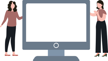 The girls are looking at the monitor.