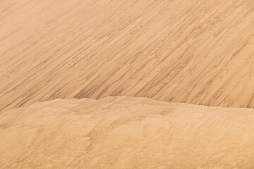 Sand mounds. Sandy natural background. Lines in the sand.