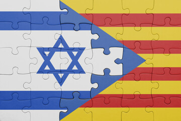 puzzle with the colourful national flag of catalonia and flag of israel.