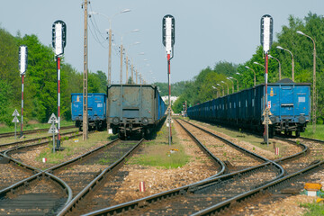 Wagons with cargo on the railway tracks.