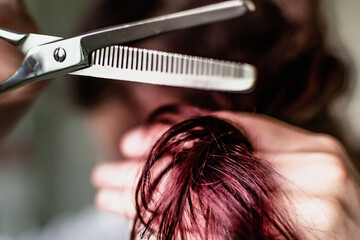 Woman with scissor to cut hair