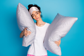 Portrait of pretty young woman sleep comfy pillow wear pajama isolated on blue color background
