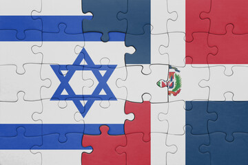 puzzle with the colourful national flag of dominican republic and flag of israel.