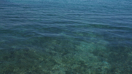 Clear turquoise sea water in porto cesareo, puglia, salento, italy, perfect for a tranquil summer vacation and serene beachfront experience.