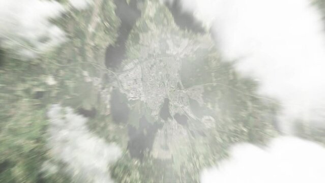 Earth zoom in from space to Vaxjo, Sweden. Followed by zoom out through clouds and atmosphere into space. Satellite view. Travel intro. Images from NASA