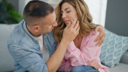 Man and woman couple hugging each other consoling at home