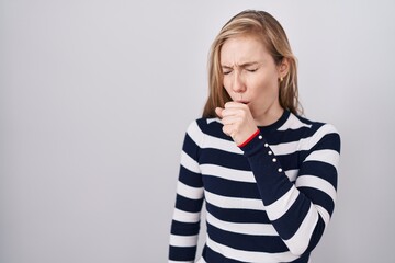 Young caucasian woman wearing casual navy sweater feeling unwell and coughing as symptom for cold...