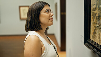 Young beautiful hispanic woman visiting art gallery at Albertina Museum in Vienna