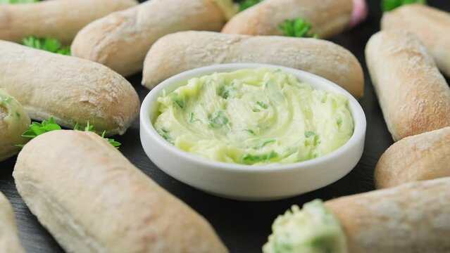 Stone baked ciabatta bread sticks with a creamy garlic butter dip. Rotating video