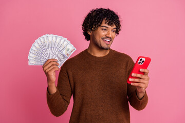 Photo of cheerful positive nice man wear trendy clothes earn money isolated on pink color background