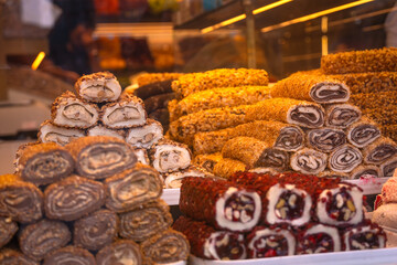Traditional Turkish delight on the counter in close-up. Delicious, varied Turkish sweets