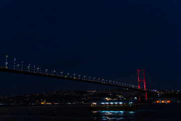 View of Istanbul Bosphorus Bridge and city lights at night, Turkey