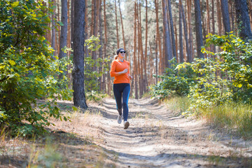 young girl on a morning run in a sunny pine forest